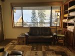 Living area with view of the pool and Alpine ski area